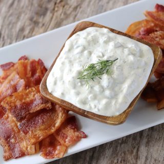 Dill pickle dip and bacon pieces for dipping.