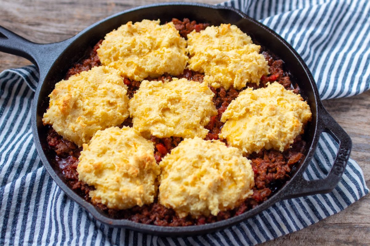 a cast iron skillet of chili cheese pot pie.