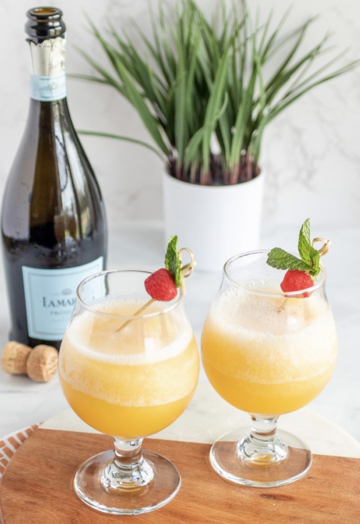 Frozen peach Bellinis and a prosecco bottle.