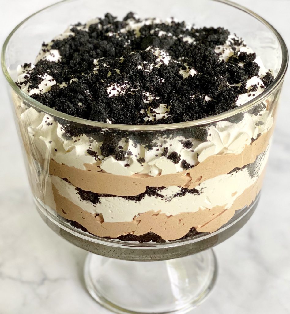 Oreo Dirt cake in a clear trifle bowl.