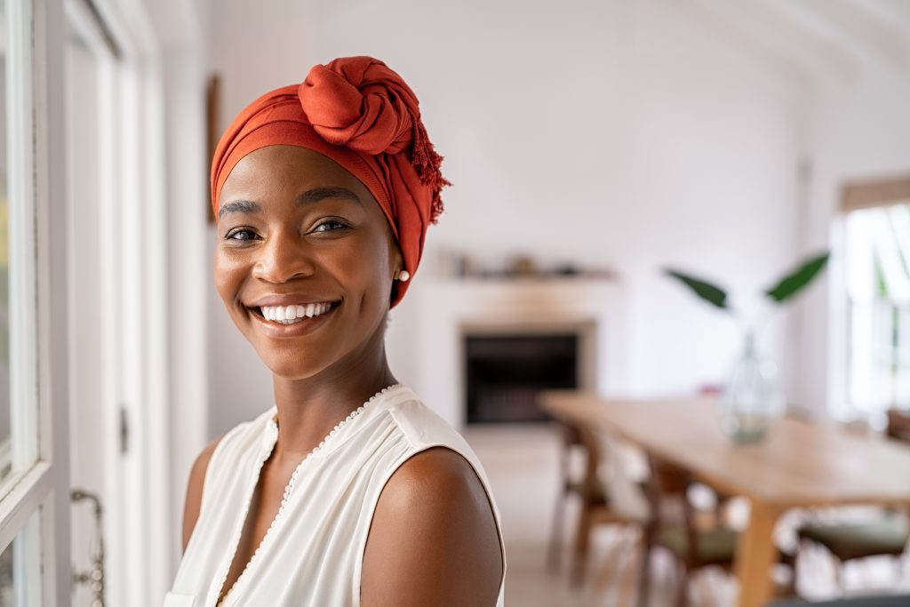 woman with red turban on head.