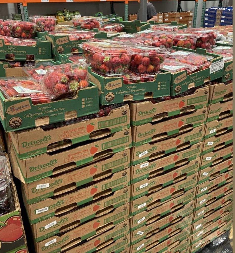 stacks of packages of strawberries at Costco.