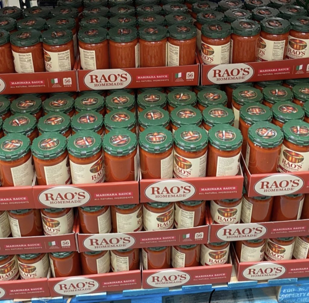 Jars of Raos marinara sauce on shelf at costco.