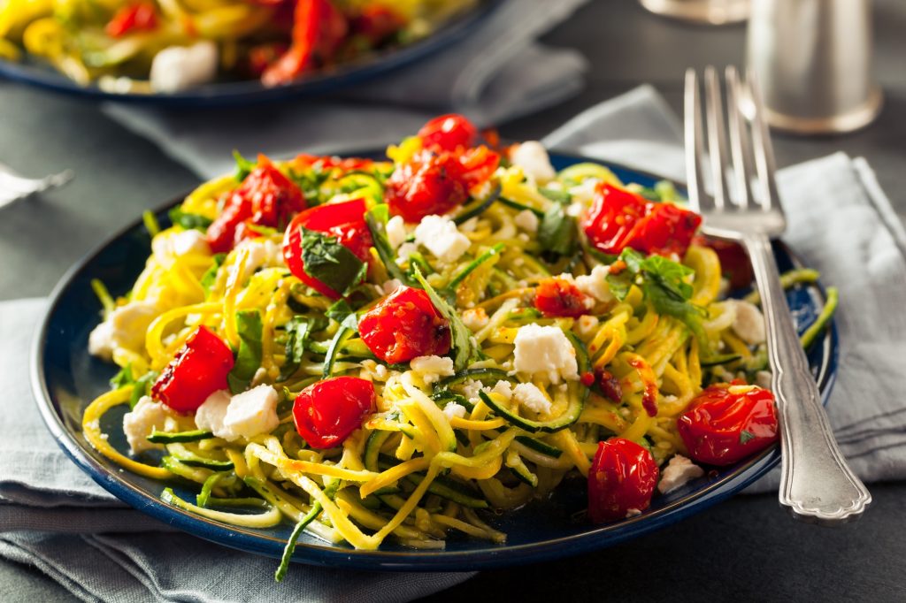 zucchini noodles, cheese and tomatoes.
