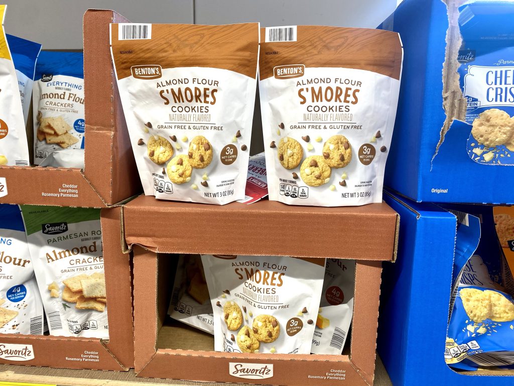 Bags of cookies on store shelf.