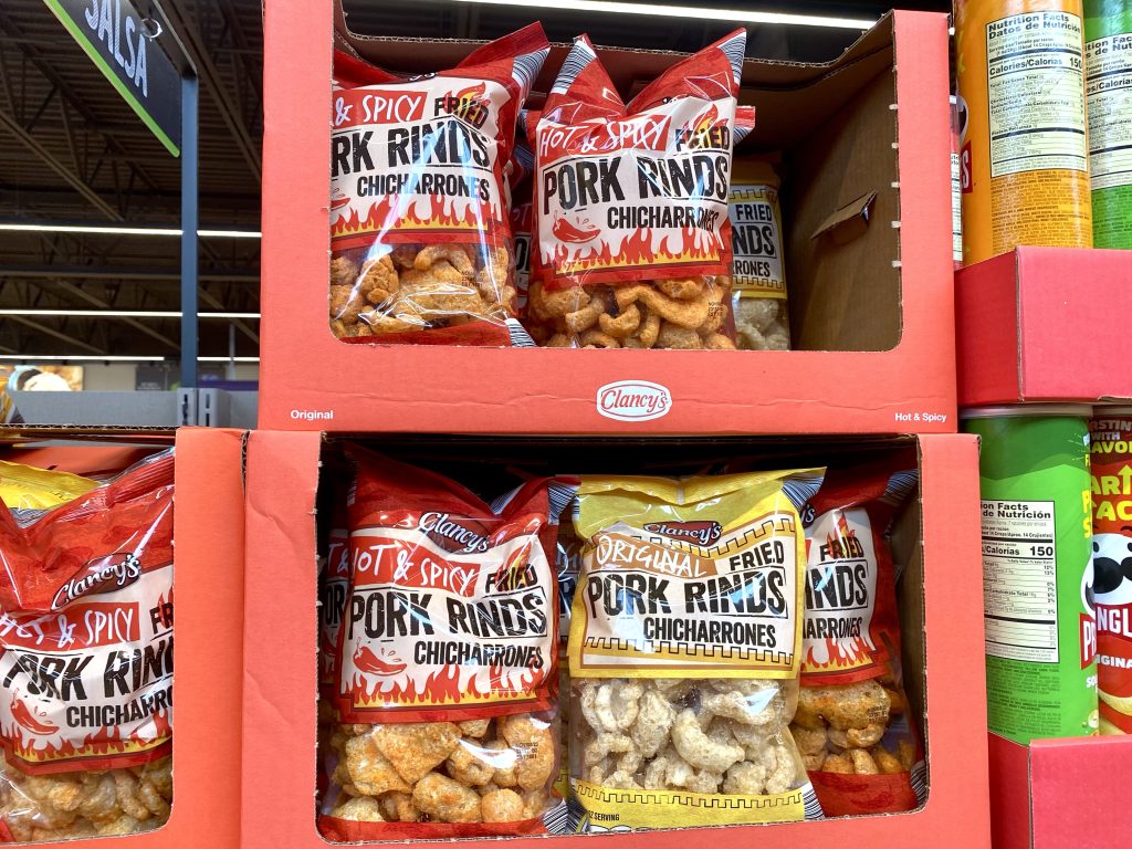 Bags of Pork rinds on the shelf.