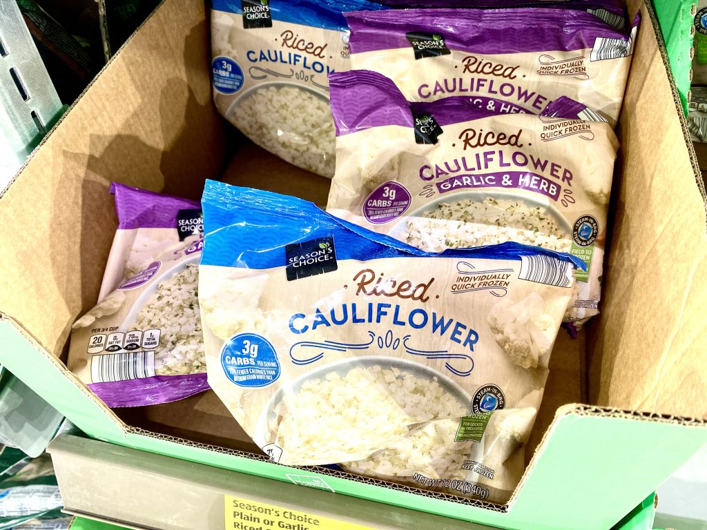 bags of riced cauliflower at grocery store.