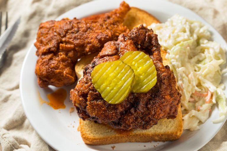 A plate of Nashville hot chicken and coleslaw.
