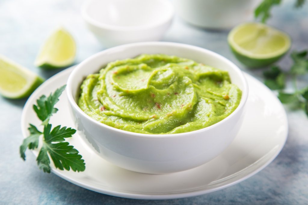 Guacamole in white bowl.