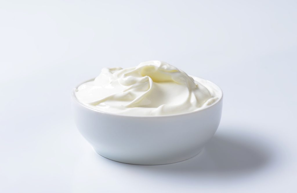 Whipped cottage cheese in a white bowl.