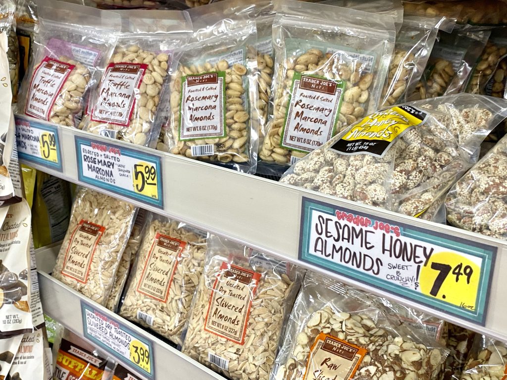 Variety of nuts on the grocery store shelf.