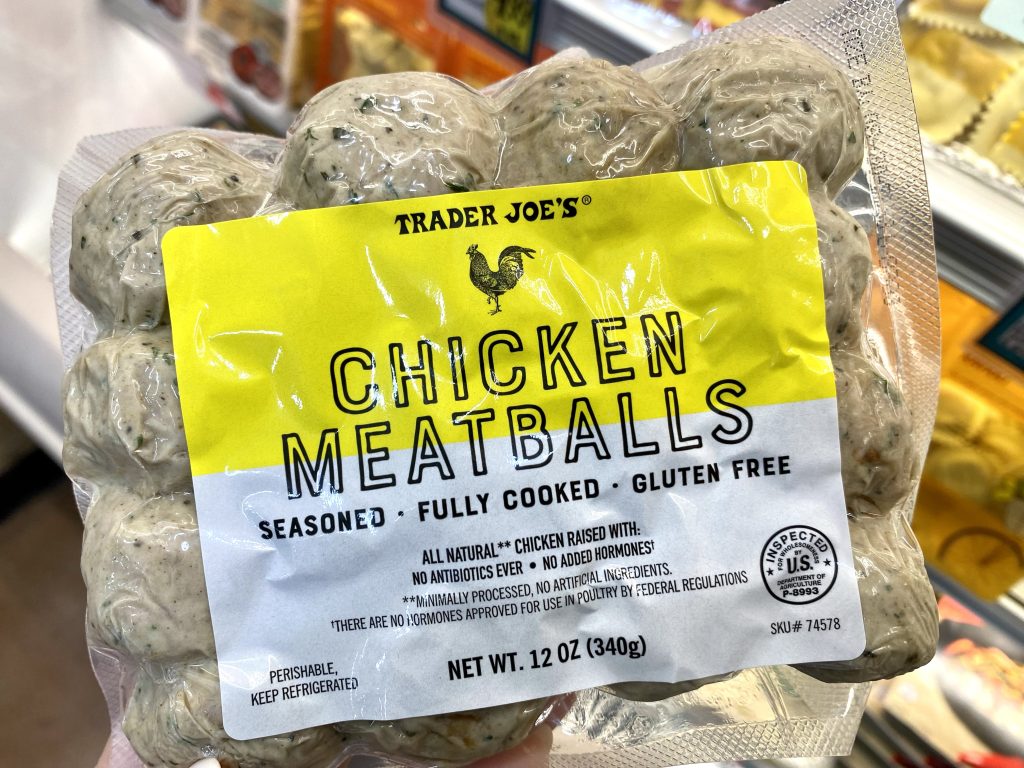 Chicken meatballs on grocery store shelf.
