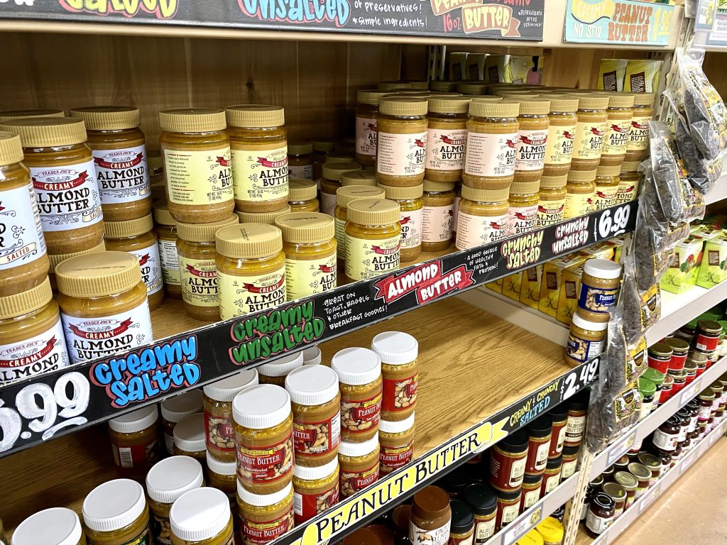 Nut butters on store shelf.
