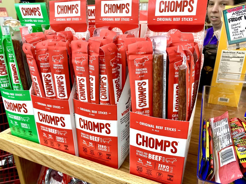 Beef sticks on store shelf.