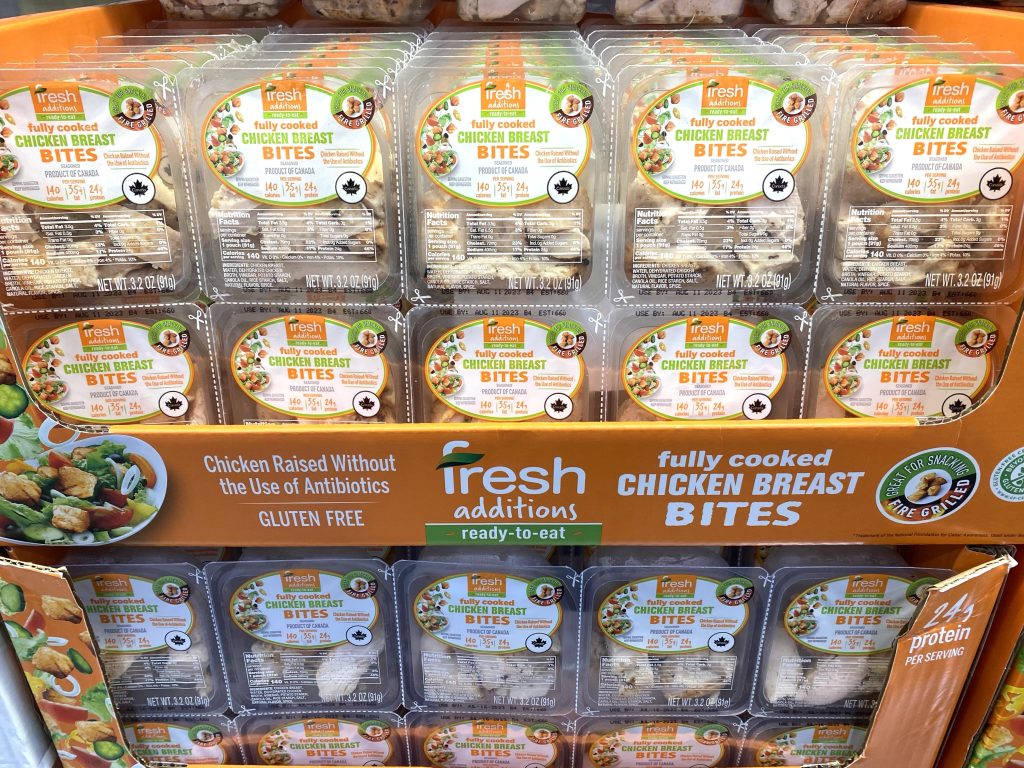 Precooked chicken on grocery store shelf.