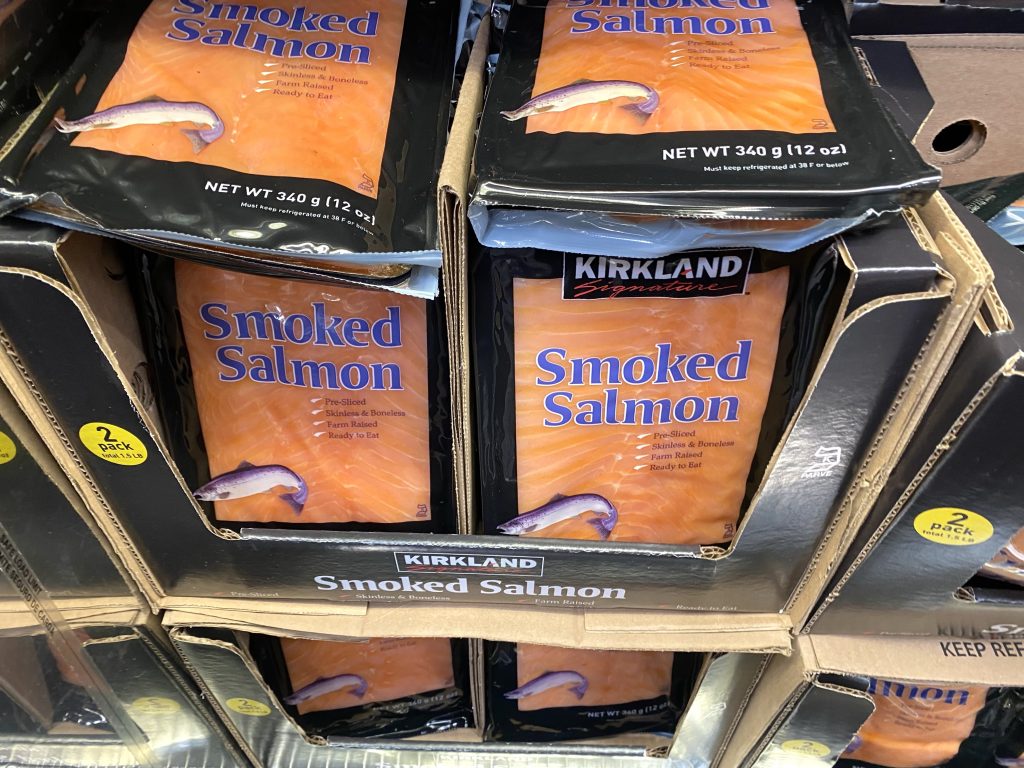Smoked salmon on grocery shelf.