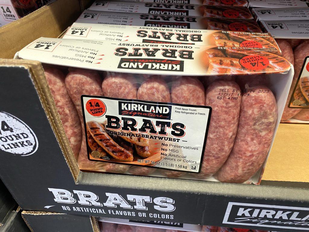 Brats on grocery shelf.