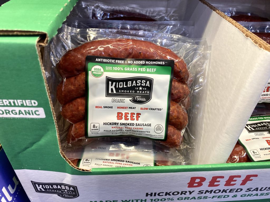 Smoked sausage on grocery shelf.