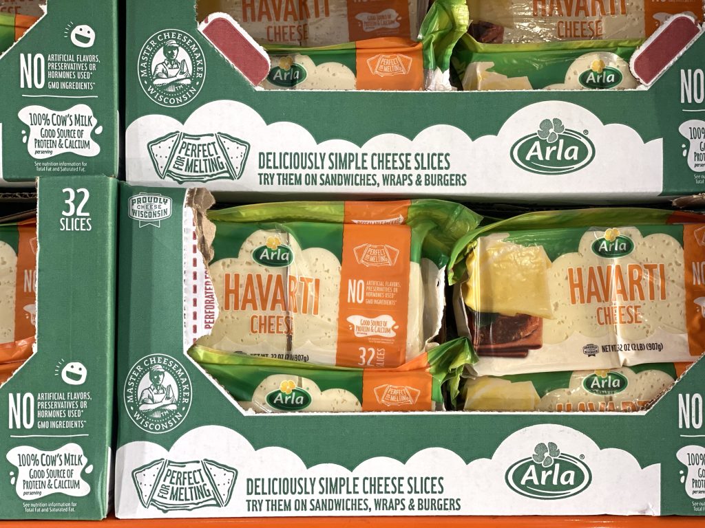Havarti cheese on grocery shelf. 