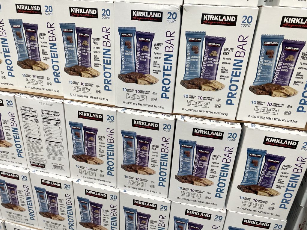 Kirkland protein bars on grocery shelf.