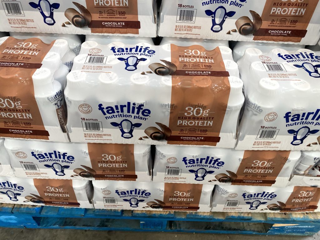 Fairlife protein shakes on shelf at grocery.