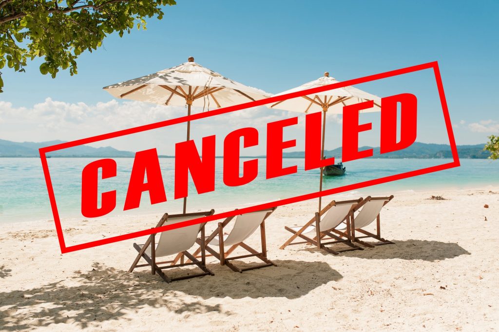 A beach scene with red graphic overlay reading, CANCELED.