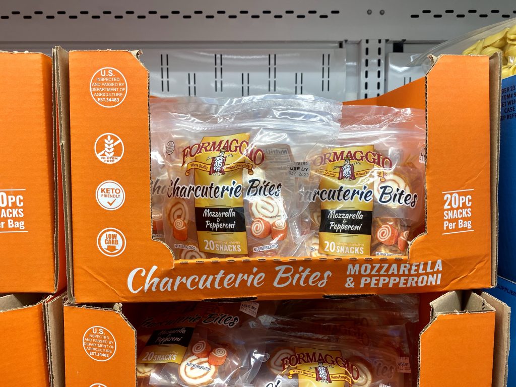 Pepperoni and Cheese pinwheels on grocery shelf.