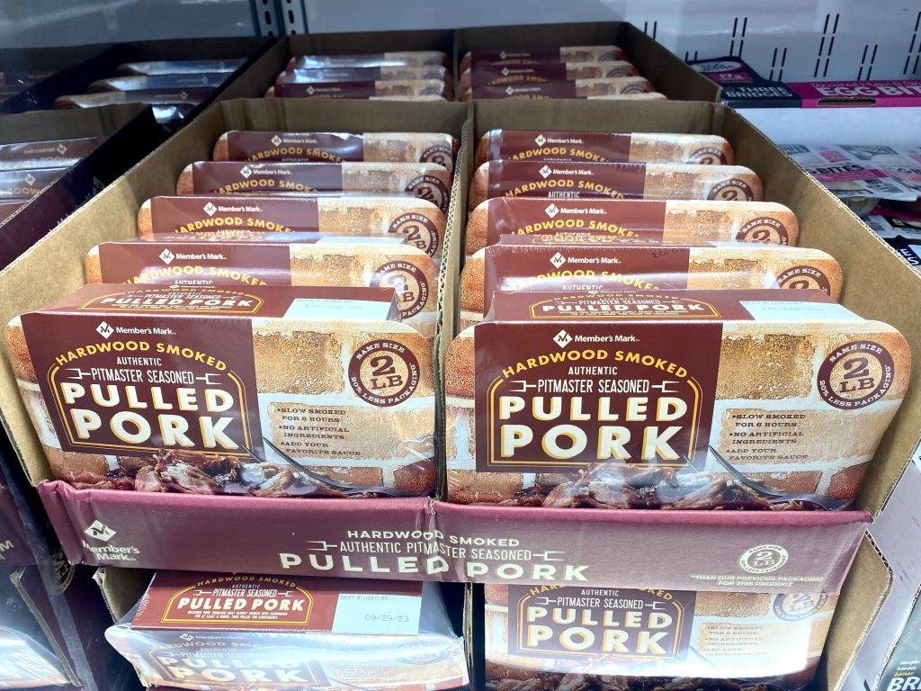 Packages of pulled pork on the grocery shelf.