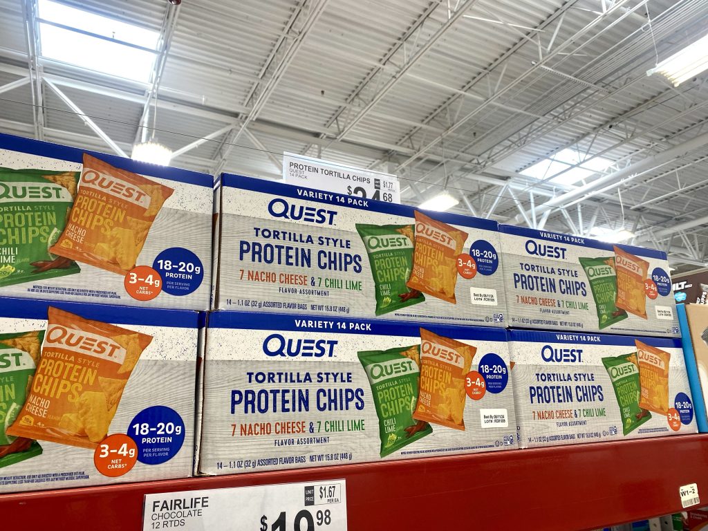 Boxes of Quest chips on the store shelf.