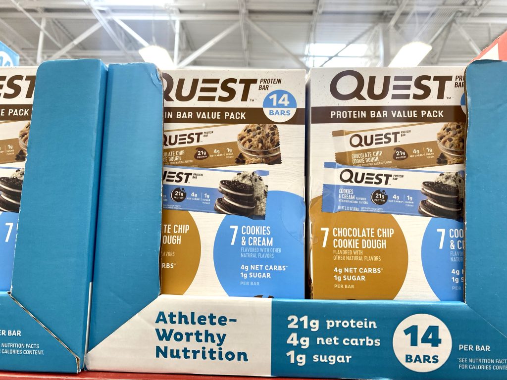 Boxes of protein bars on grocery shelf.