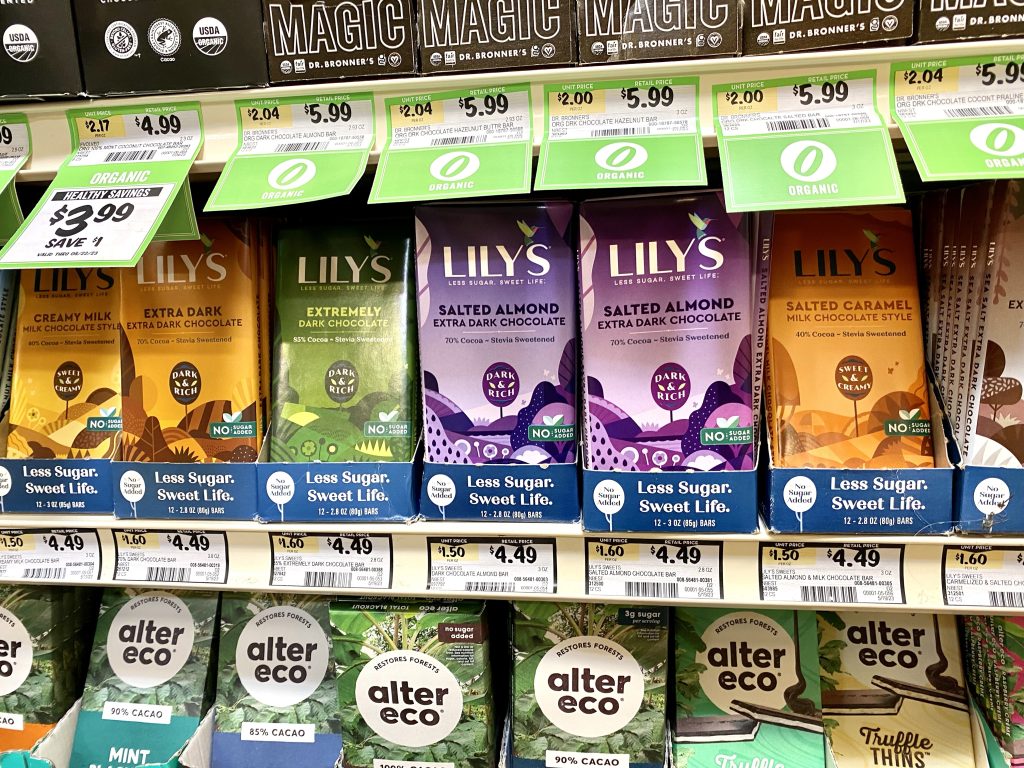 Lily's candy bars on grocery shelf.
