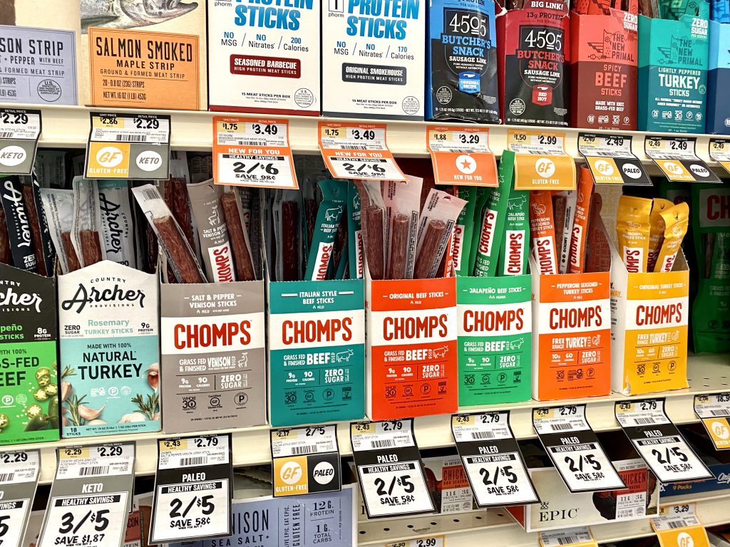 chomps beef sticks on grocery shelf.
