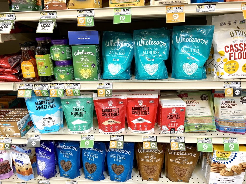 A grocery store shelf with a variety of sugar alternatives.