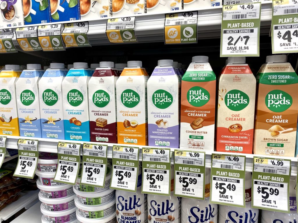 a variety of nutpod creamer flavors in the store cooler section.