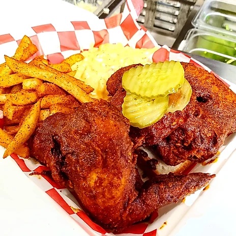 A plate of Red's Kitchen Nashville Hot Chicken.