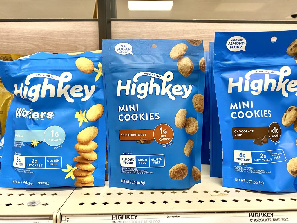 Packages of low carb cookies on store shelf.