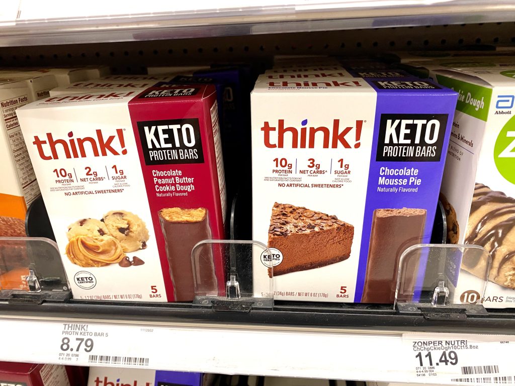 Boxes of Protein bars on store shelf.