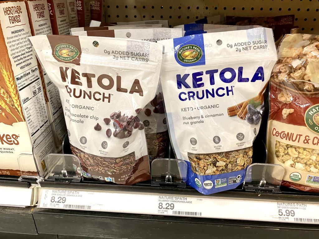 packages of keto granola on store shelf.