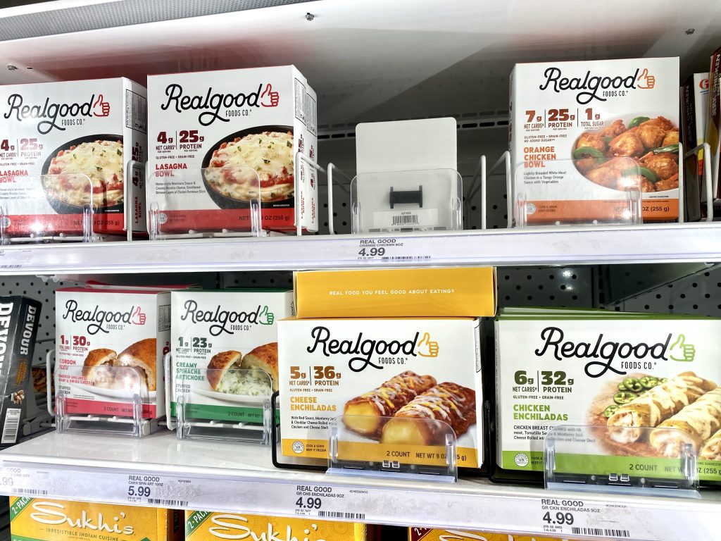Real Foods low carb meals in freezer section at grocery store.