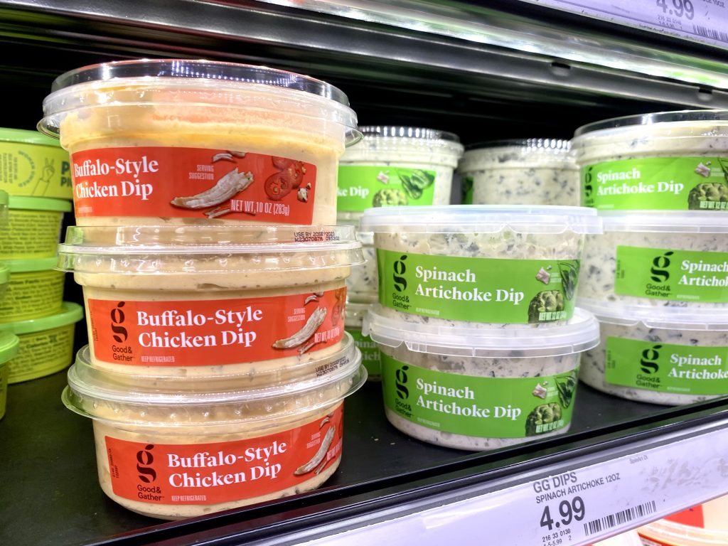 Packages of Dip on grocery store shelf.