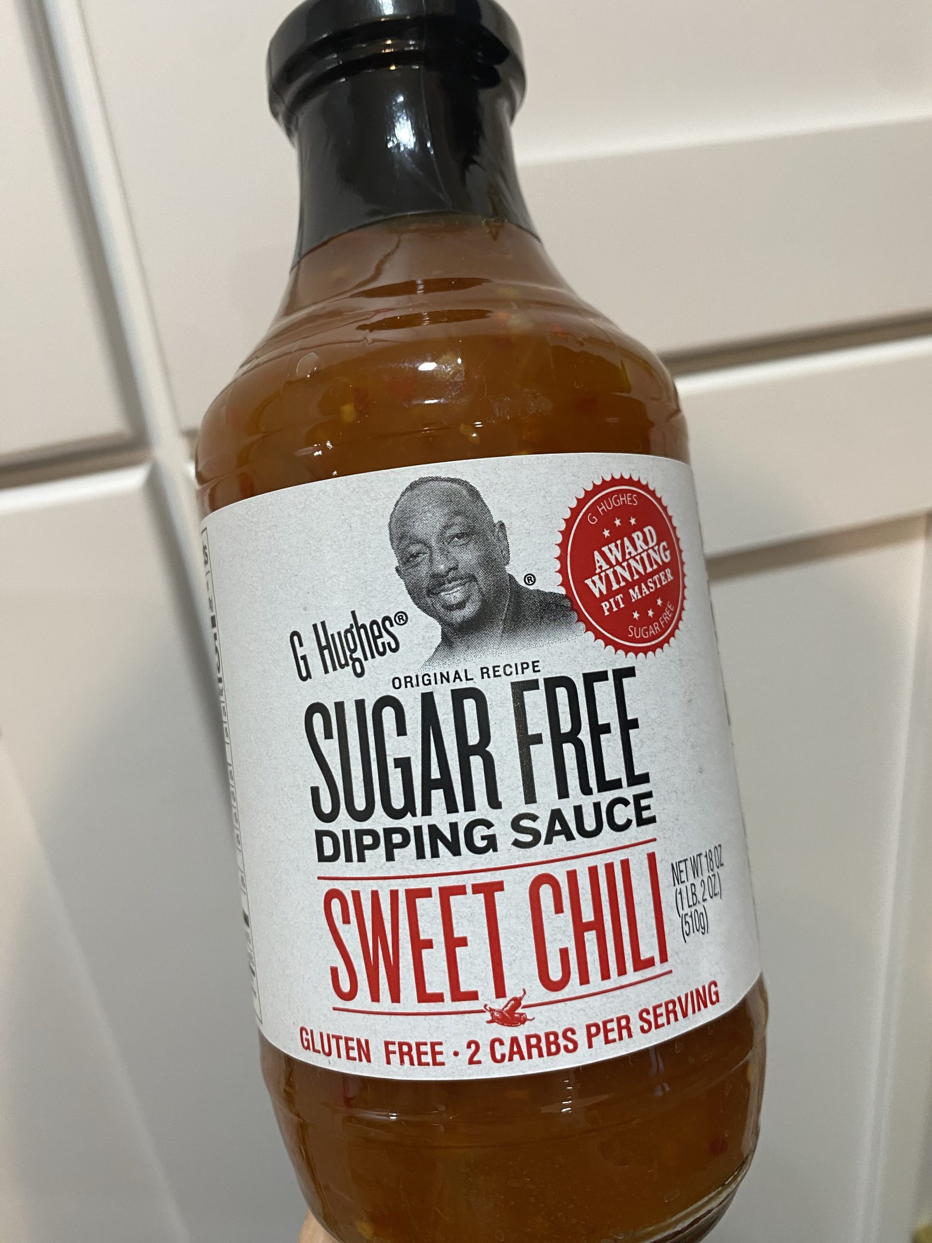A bottle of sugar free sweet chili sauce.  