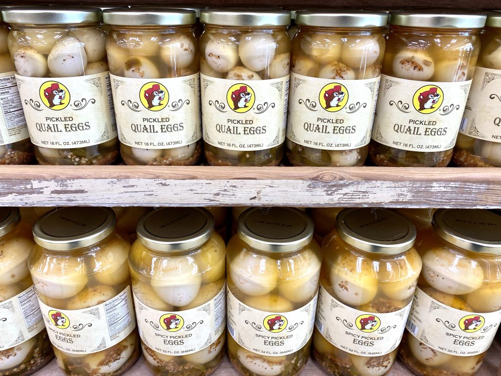 Jars of pickled eggs on shelf at Buc-ee's