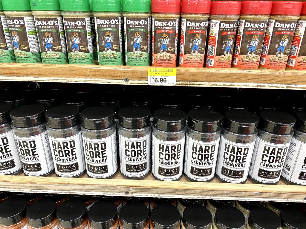 Bottles of various seasonings on shelf at Buc-ee's.