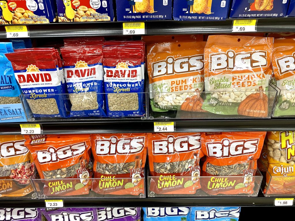 Packages of a variety of seeds, sunflower, pumpkin and more on grocery store shelf.