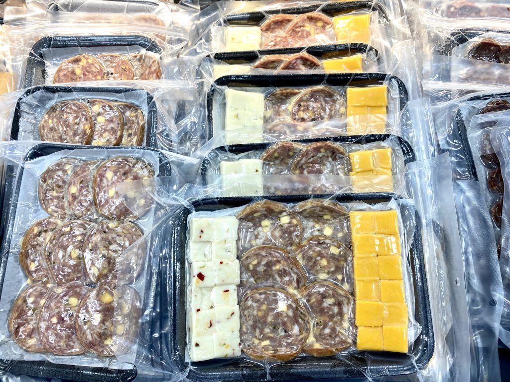 Meats and cheeses wrapped individually as snacks at convenience store.