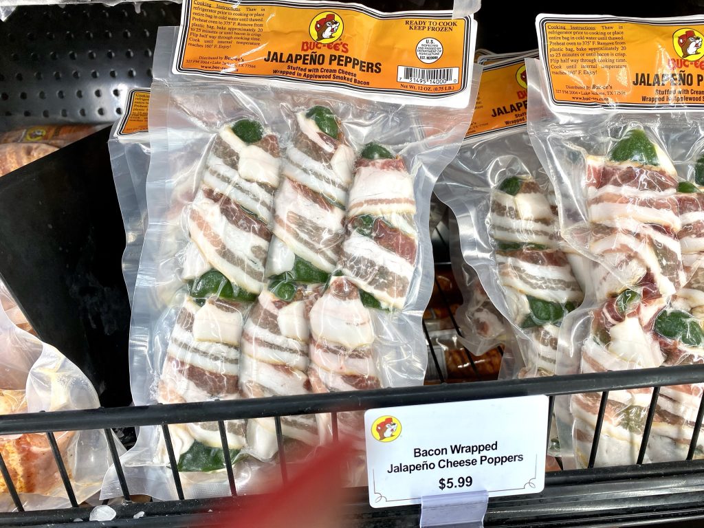 Uncooked packaged bacon jalapeno Poppers in refrigerated cooler at Buc-ee's