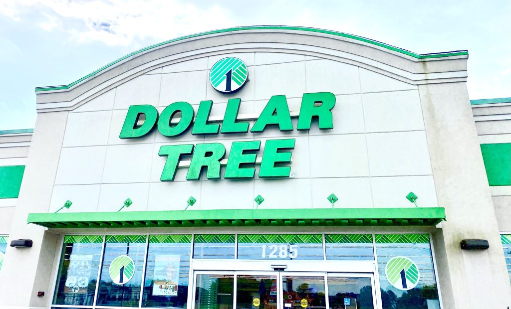 The Dollar Tree sign on the front of the building.