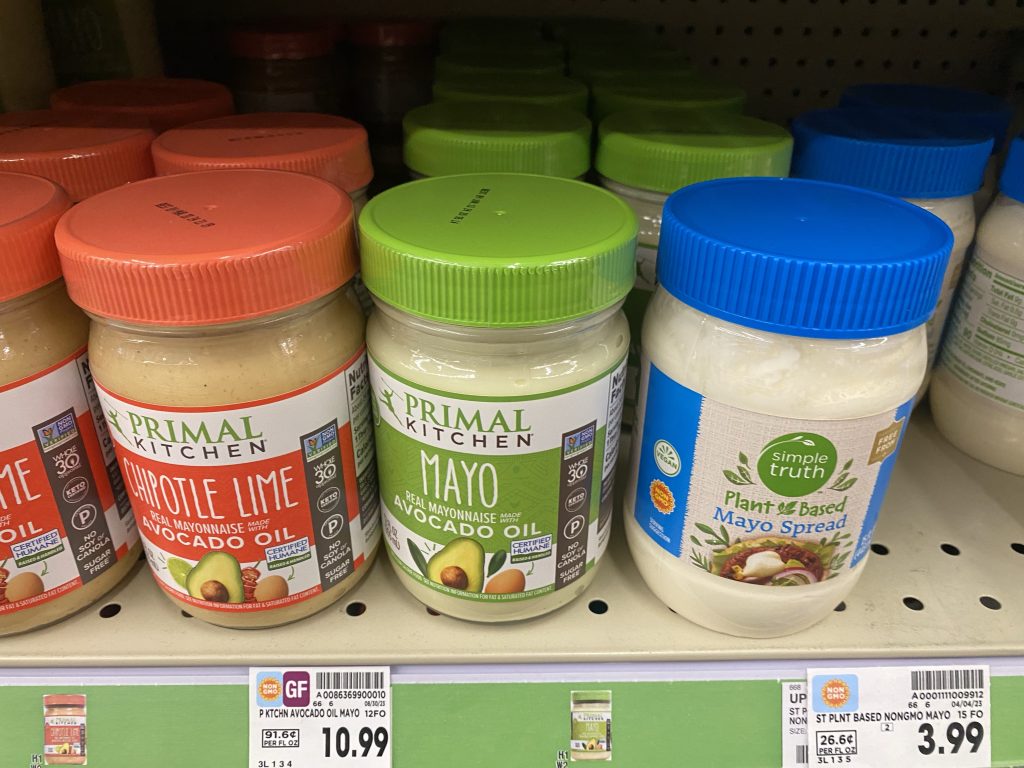 3 flavors of primal kitchen mayonnaise on store shelf.