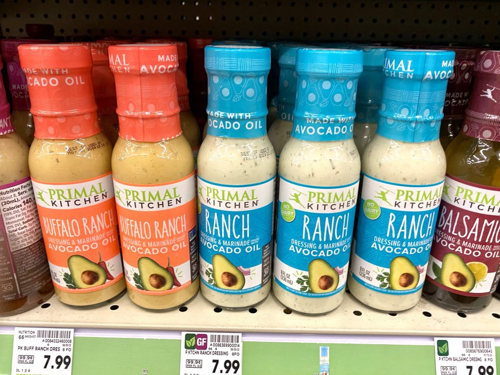 Keto friendly salad dressings on grocery shelf.