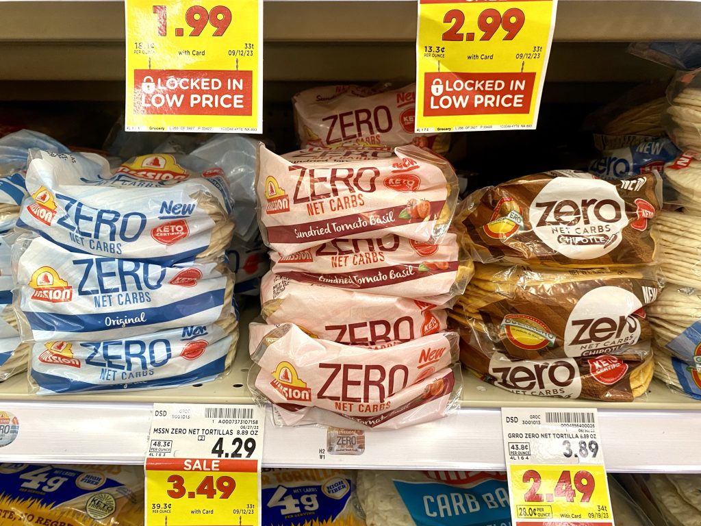 A variety of flavors of low carb tortillas on a store shelf.